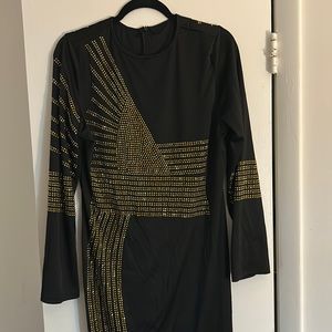 Long sleeved black and gold studded dress